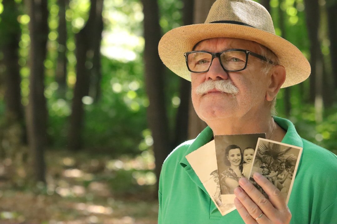 elderly person with old photo