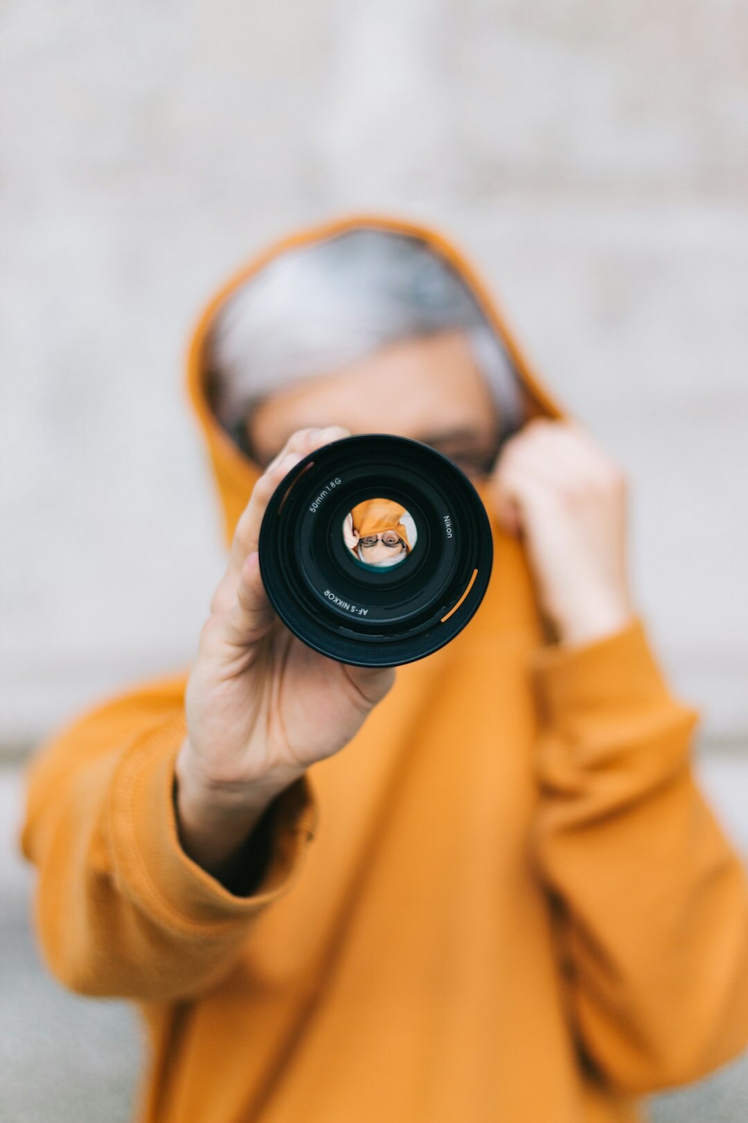 young person with camera