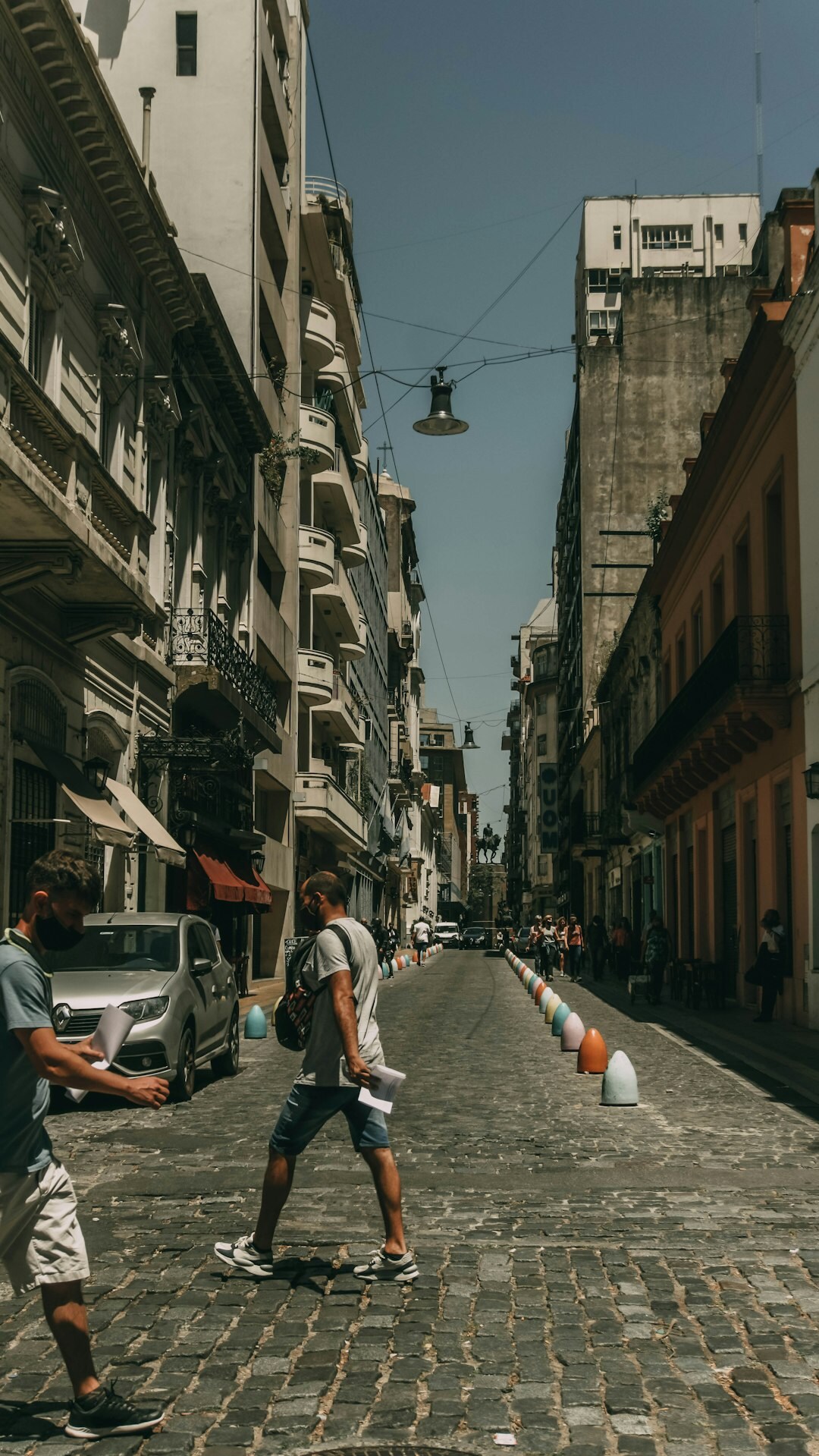 teenagers playing street soccer