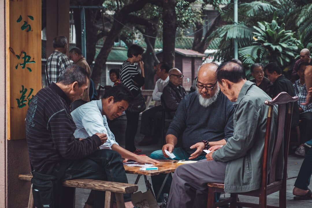 group of men playing cards